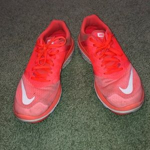 Bright orange Nike sneakers